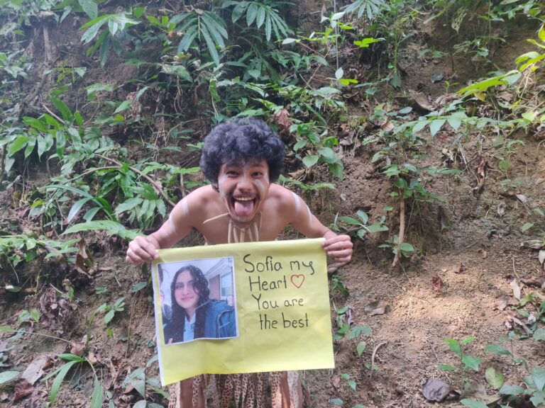 Person laughing while watching group funny greeting videos.